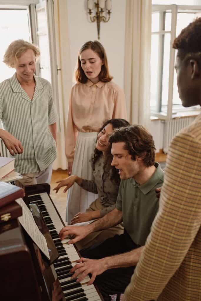 people singing with piano