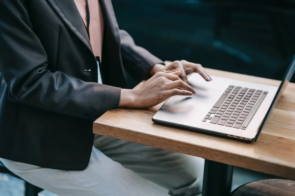 ethnic female remote worker using laptop for business project